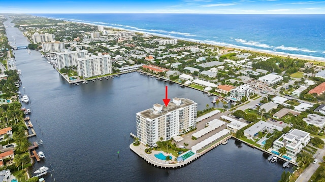 drone / aerial view featuring a view of the beach and a water view