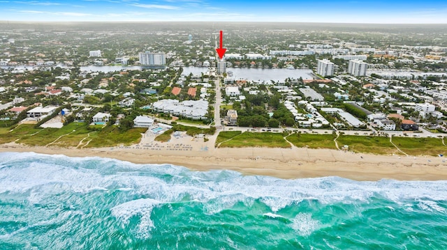 aerial view featuring a water view and a beach view