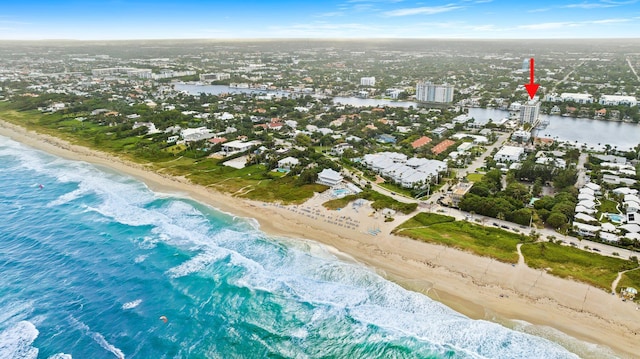 birds eye view of property featuring a view of the beach and a water view