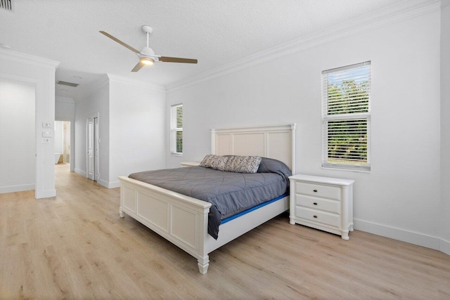 bedroom with ornamental molding, light hardwood / wood-style floors, a textured ceiling, and ceiling fan