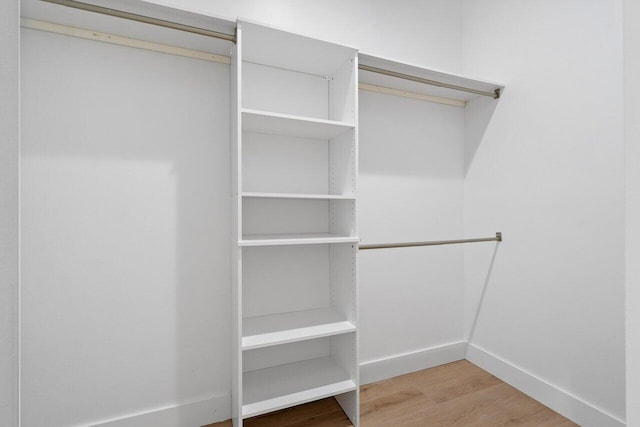 walk in closet featuring hardwood / wood-style flooring