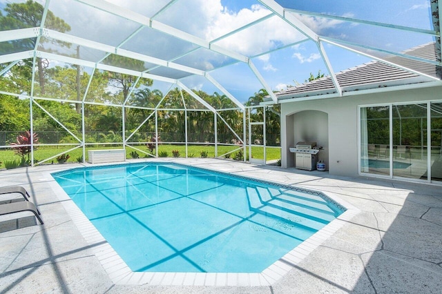 view of pool with a lanai and a patio area