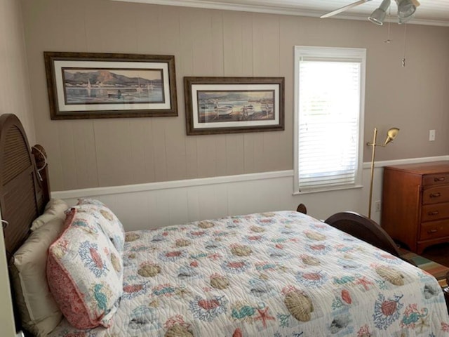 bedroom featuring ornamental molding and ceiling fan