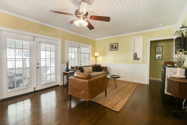 living room featuring crown molding, dark hardwood / wood-style floors, and french doors