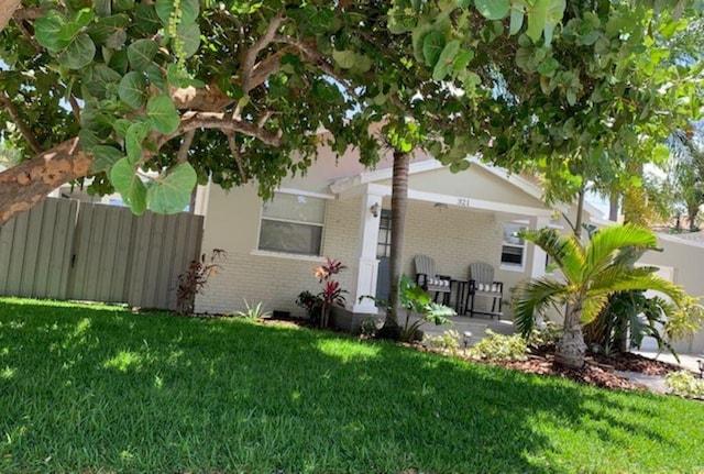 view of side of property with a yard