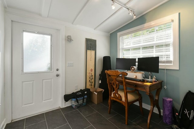 tiled office with rail lighting and lofted ceiling