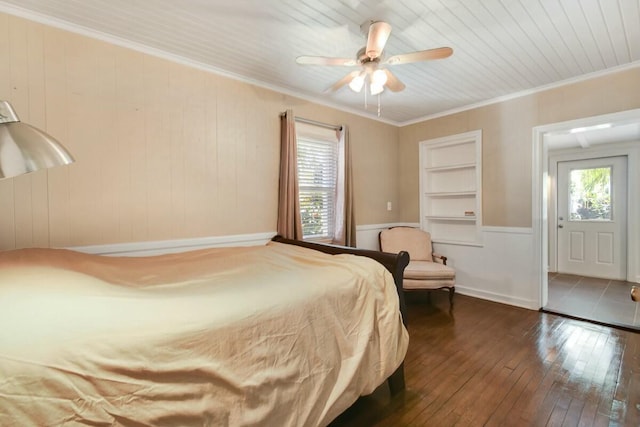 bedroom featuring crown molding, ceiling fan, dark hardwood / wood-style floors, and multiple windows