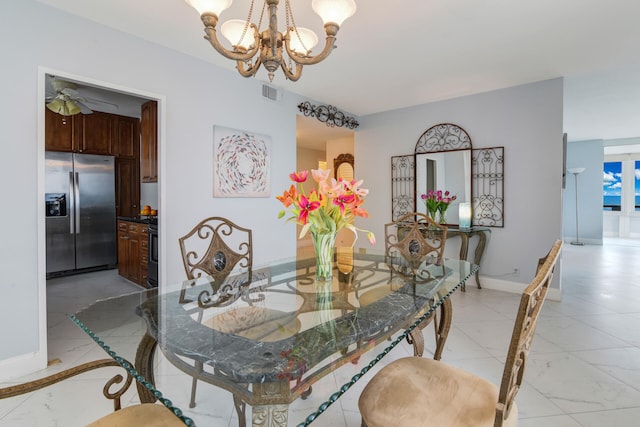 dining area featuring ceiling fan with notable chandelier