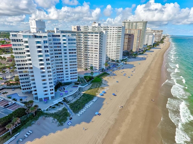 aerial view featuring a water view and a beach view