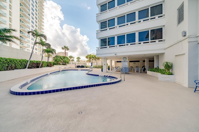 view of swimming pool featuring a patio area