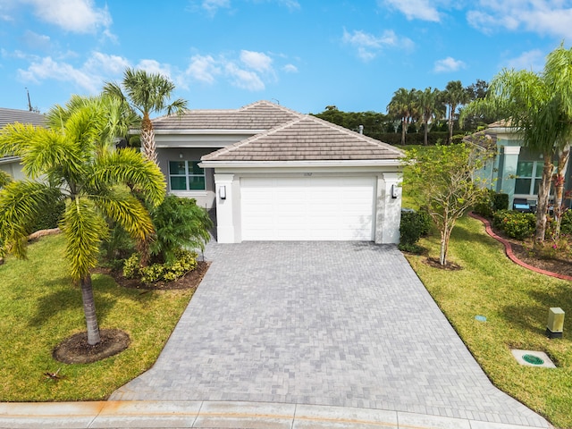 view of front facade with a garage and a front yard