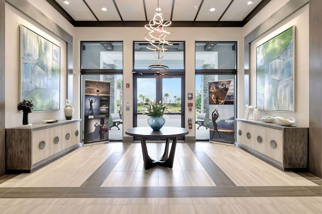 interior space with french doors and a chandelier