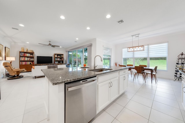 kitchen with dishwasher, a kitchen island with sink, sink, and plenty of natural light