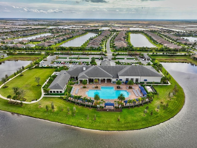 birds eye view of property featuring a water view