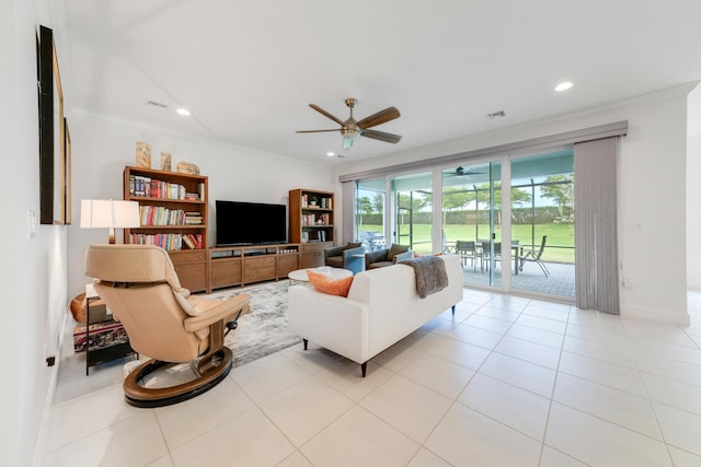 living room with light tile patterned floors, crown molding, and ceiling fan