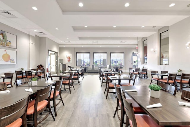 dining area with light hardwood / wood-style floors