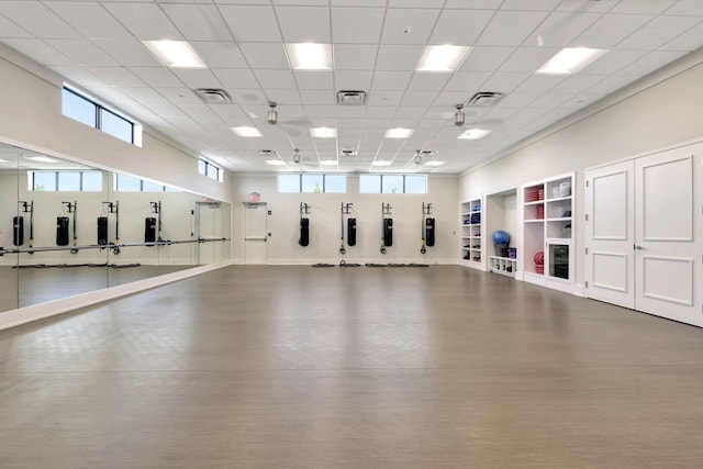 exercise area with a paneled ceiling