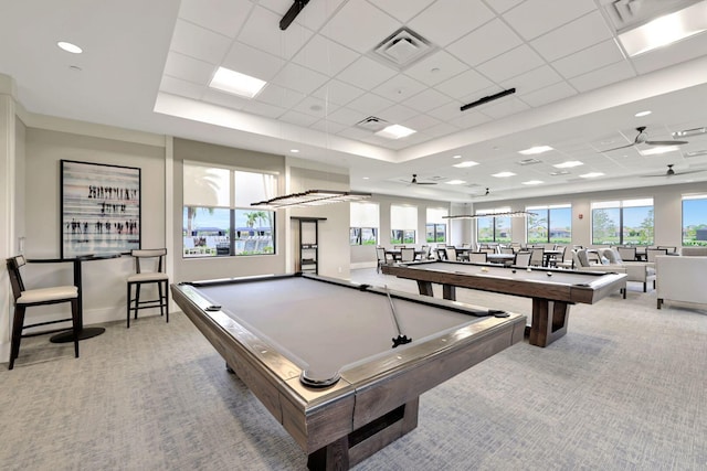 recreation room featuring a tray ceiling, light carpet, billiards, and a drop ceiling