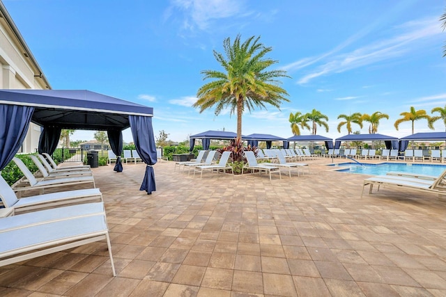 view of patio / terrace with a gazebo and a community pool