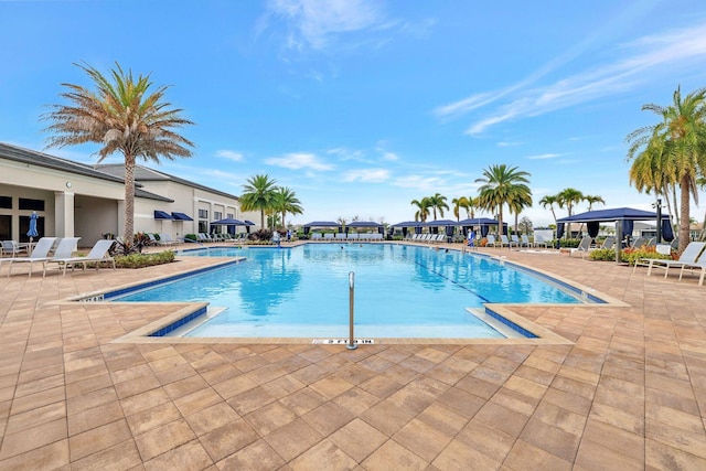 view of swimming pool with a patio area