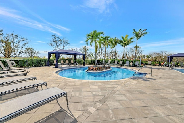 view of pool with a patio and a gazebo