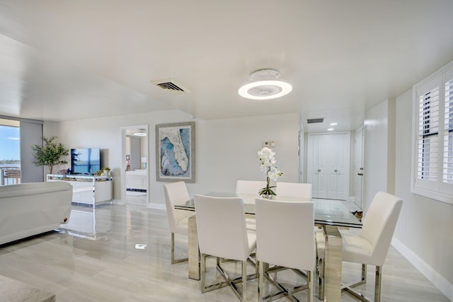 dining space with plenty of natural light