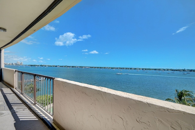 balcony featuring a water view