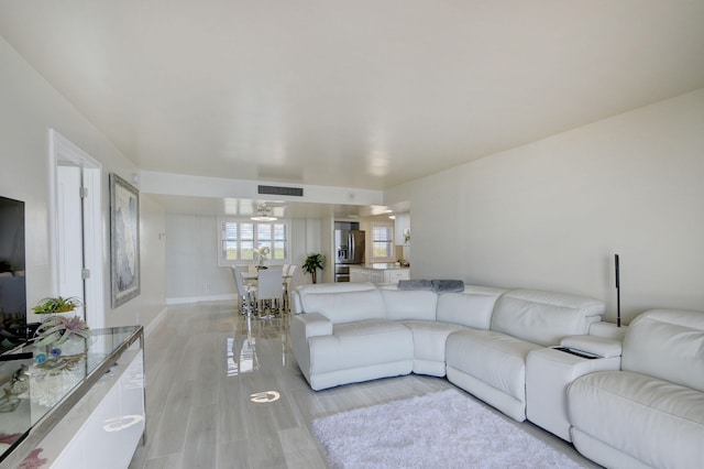 living room with light hardwood / wood-style floors