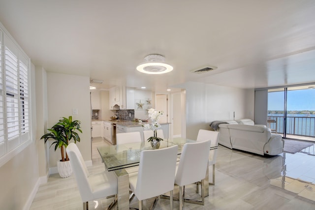 dining room with a water view