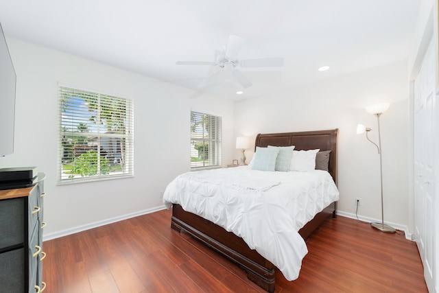 bedroom featuring a closet, ceiling fan, and dark hardwood / wood-style floors