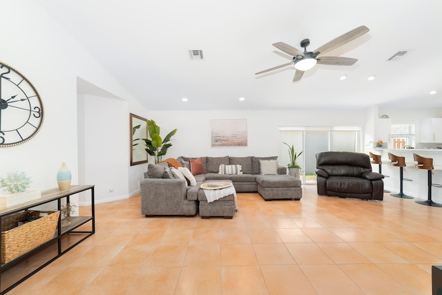 living room featuring ceiling fan and light tile patterned floors