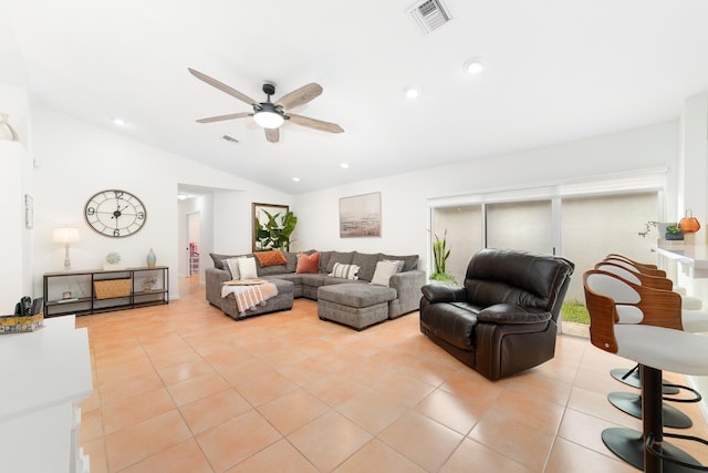 tiled living room with lofted ceiling and ceiling fan