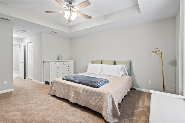 541 SW Nadell Ct, Port Saint Lucie, FL 34953 - carpeted bedroom featuring a raised ceiling, baseboards, and a ceiling fan