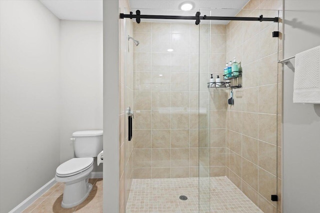 bathroom featuring tile patterned flooring, toilet, and walk in shower