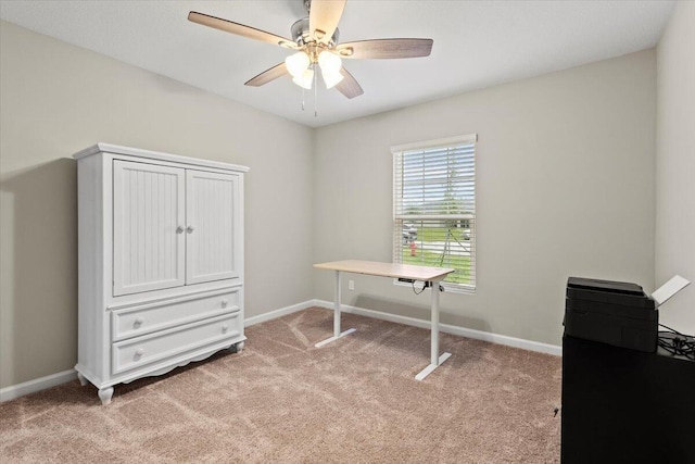 miscellaneous room featuring light colored carpet and ceiling fan