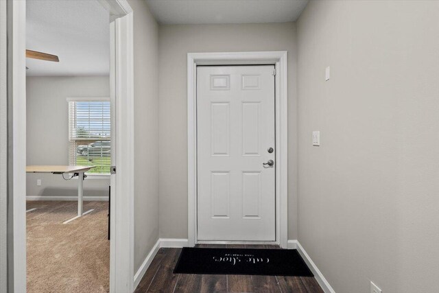 doorway with wood-type flooring