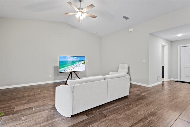 living room with vaulted ceiling, dark hardwood / wood-style flooring, and ceiling fan