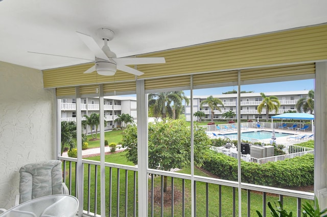 sunroom / solarium with ceiling fan