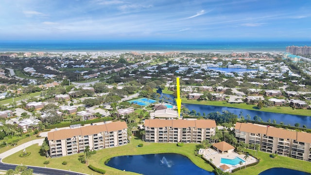 birds eye view of property featuring a water view