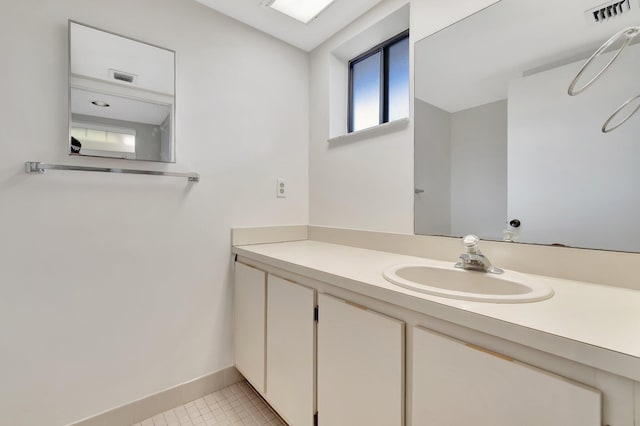 bathroom featuring vanity and tile patterned flooring