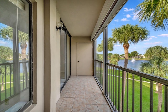 balcony featuring a water view