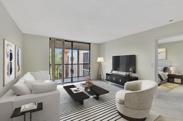 tiled living room featuring a wall of windows and a healthy amount of sunlight