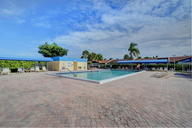 view of swimming pool featuring a patio