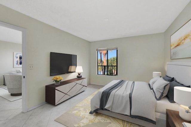 bedroom with light tile patterned floors