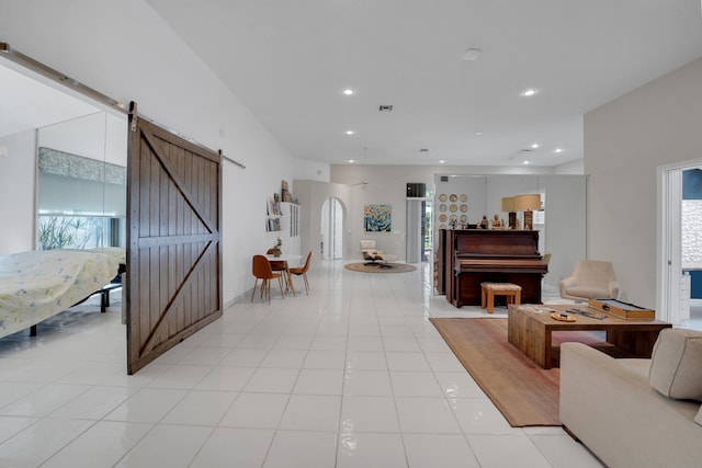 tiled entrance foyer with a barn door