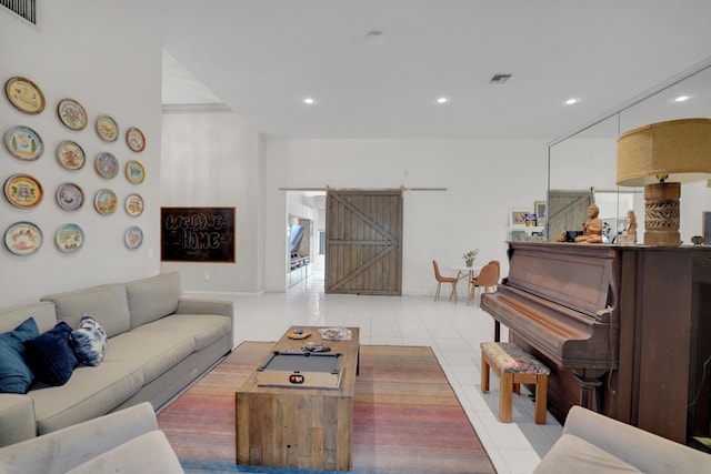 tiled living room featuring a barn door