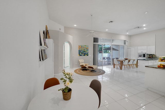 tiled dining room with ceiling fan