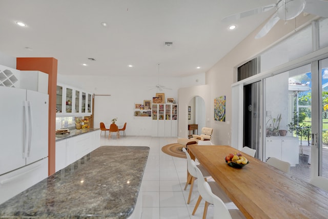 dining room featuring ceiling fan and light tile patterned floors