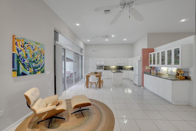 interior space featuring ceiling fan