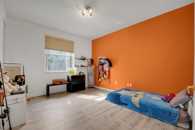 bedroom with light wood-type flooring